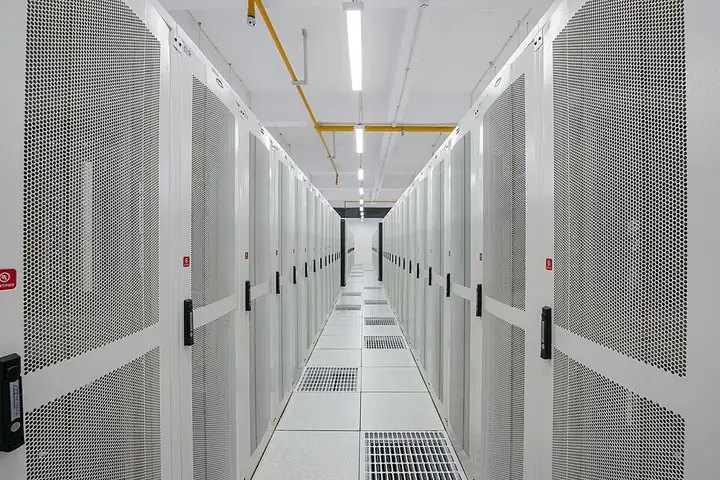 Aisle of server racks in a data center