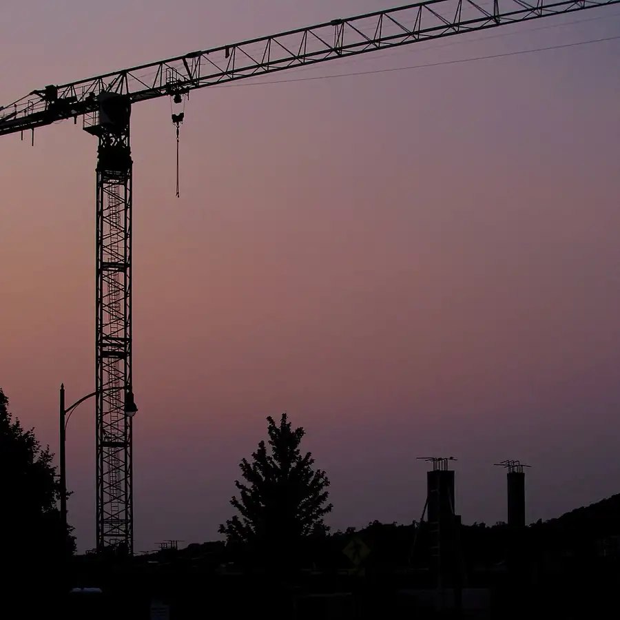 Tower crane against a dusk sky