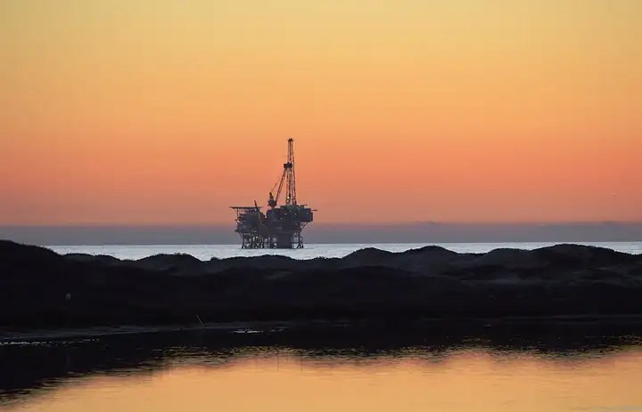 Offshore oil platform at sunset